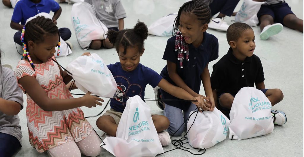 Children participating in Blessings in a Backpack (Photo Credit: William Estep/Nemours Children's Health System)