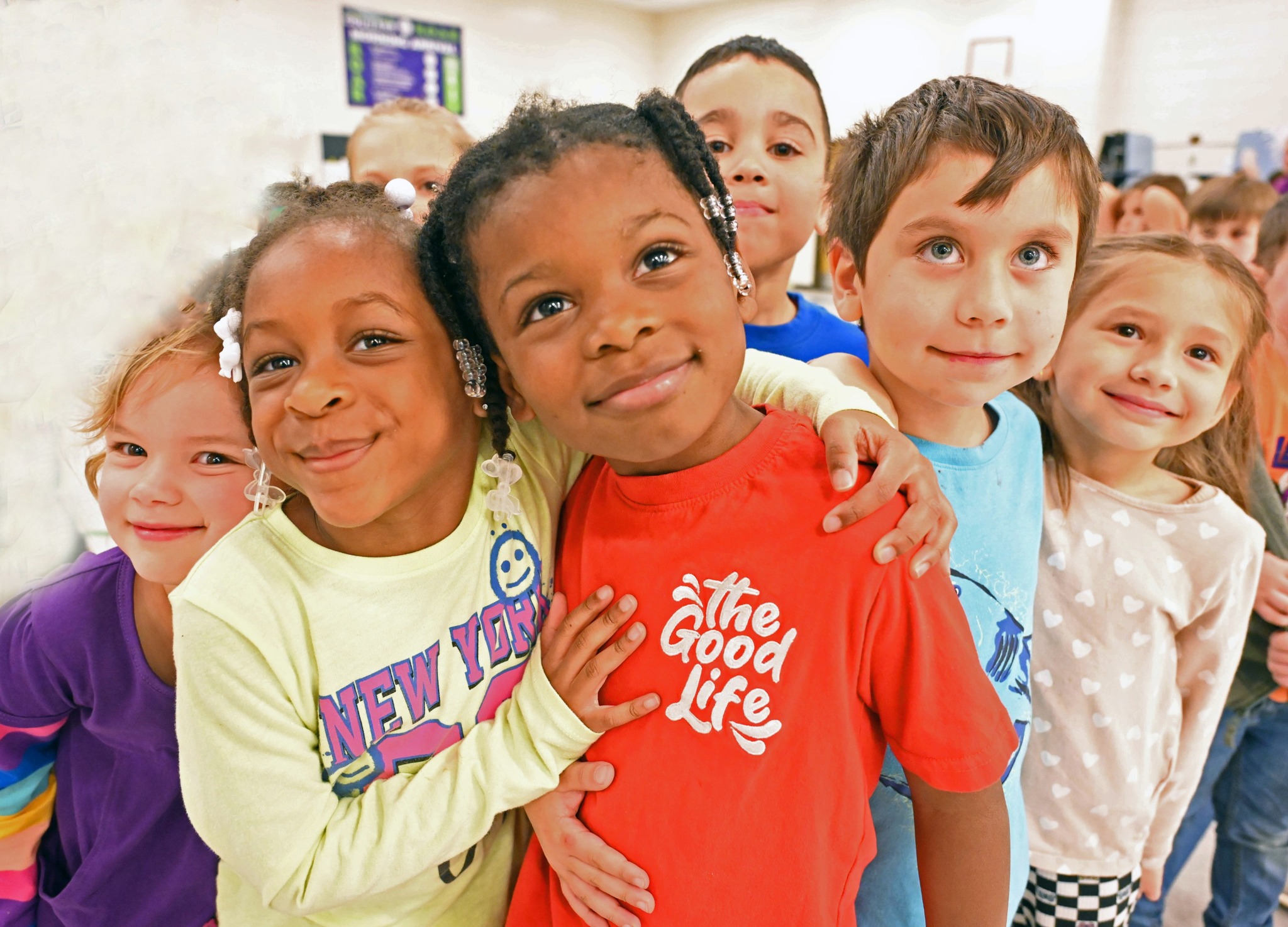 Elementary-age children going back to school in summer 2024